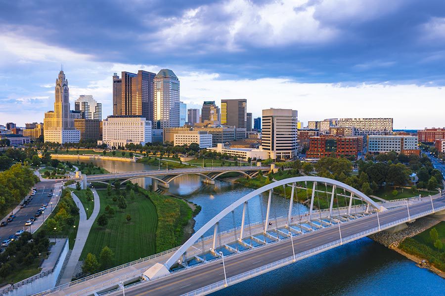 About Our Agency - Columbus, Ohio Skyline and Bridge at Dusk